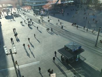 High angle view of people walking on city street