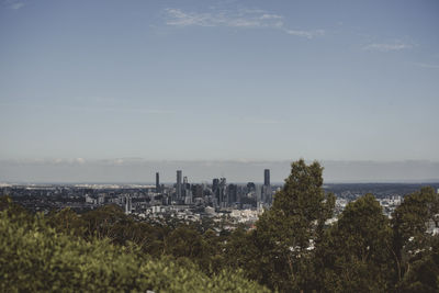 Scenic view of sea and buildings against sky