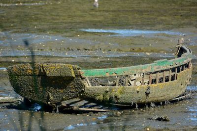 Abandoned boats in sea