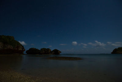 Scenic view of sea against sky at night