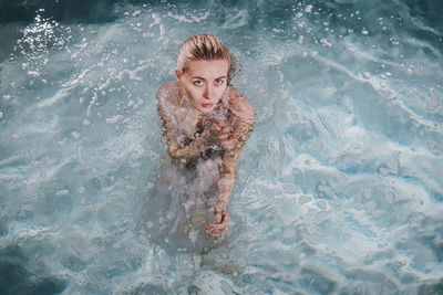 Portrait of woman in swimming pool