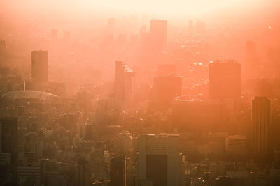 High angle view of cityscape against sky during sunset