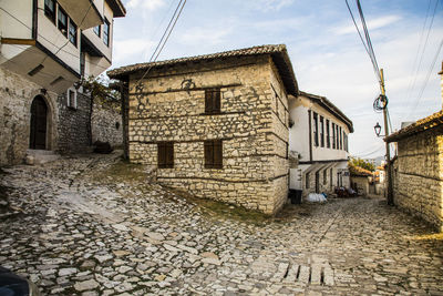 Footpath amidst buildings in town