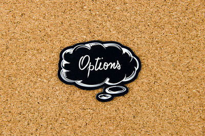 High angle view of text on sand