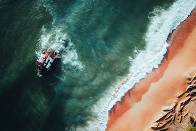 High angle view of man surfing in sea