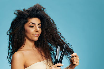 Portrait of smiling young woman looking away