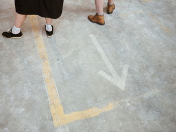 Low section of people walking on road