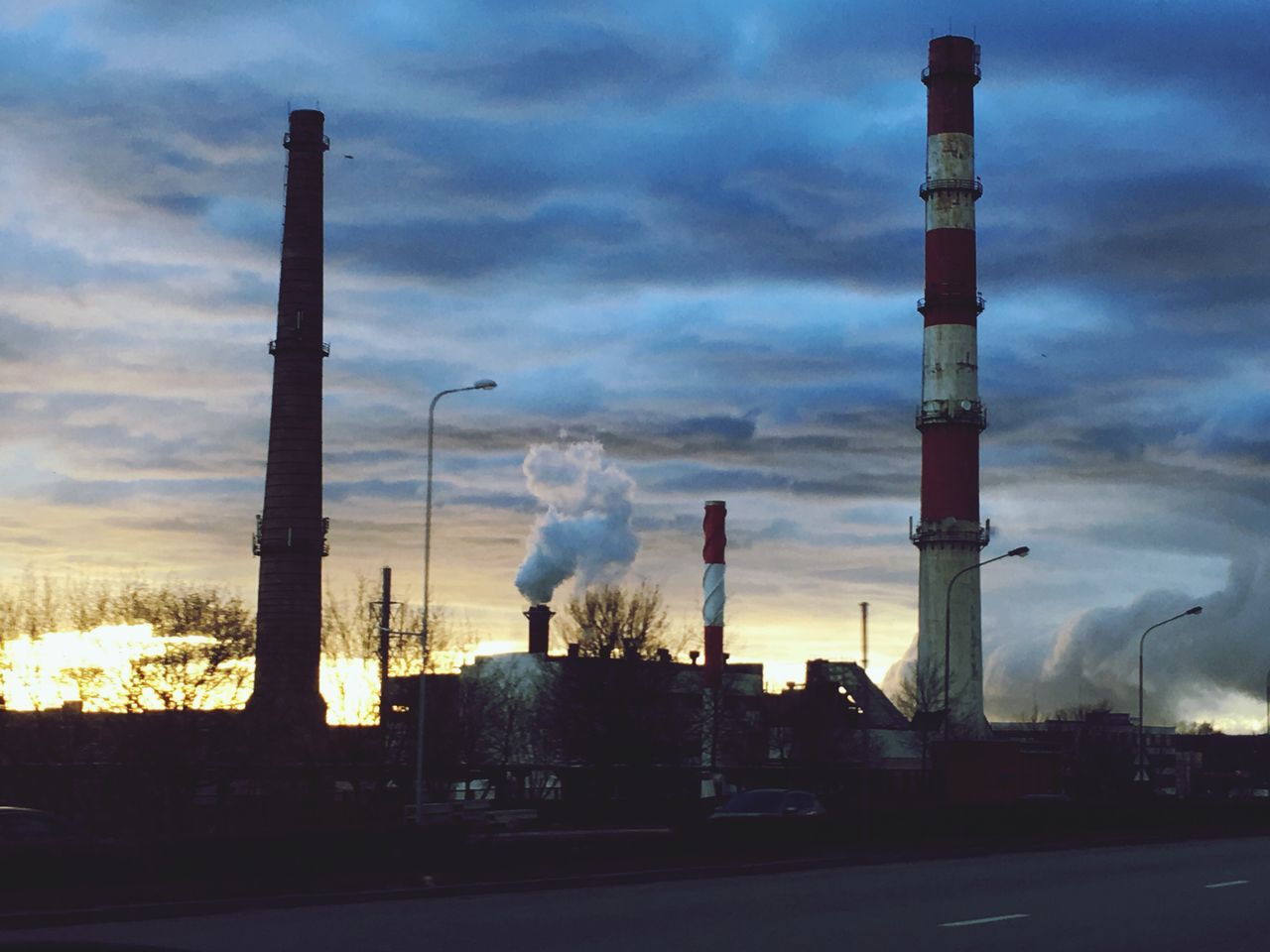 factory, smoke stack, industry, environment, smoke - physical structure, built structure, air pollution, environmental issues, emitting, sky, fumes, cloud - sky, chimney, architecture, ecosystem, outdoors, no people, business finance and industry, day, global warming