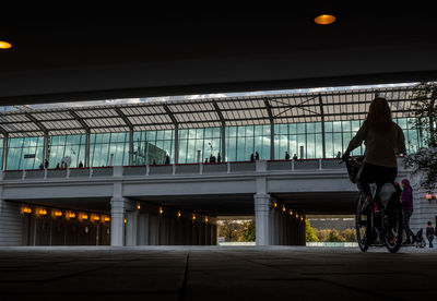 Rear view of woman cycling at luzhniki stadium