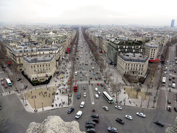 Vehicles on road along buildings