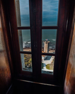 Sea seen through glass window at home