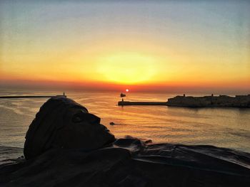 Scenic view of sea against sky during sunset