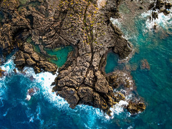 High angle view of rocks on shore