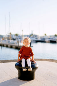 Portrait of boy sitting in boat