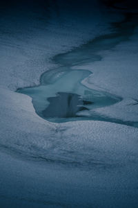 High angle view of frozen water at night