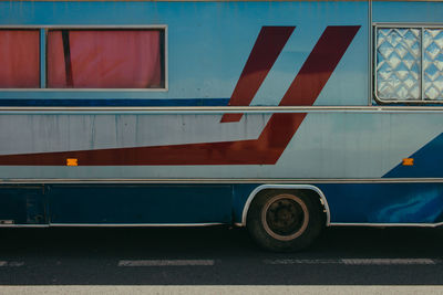 Close-up of bus on road