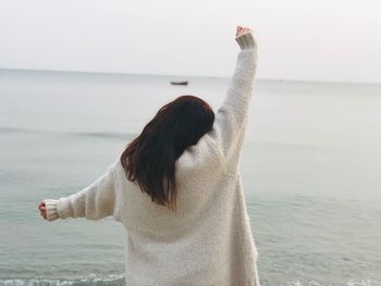 Rear view of woman looking at sea