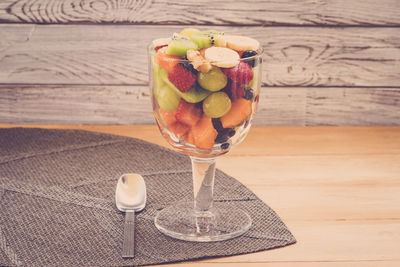 Close-up of fruit and drink on table