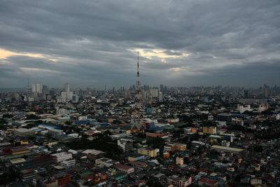 High angle view of city against cloudy sky