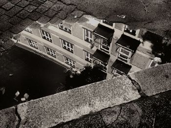 Reflection of buildings in puddle