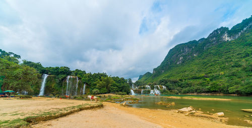 Panoramic view of lake against cloudy sky