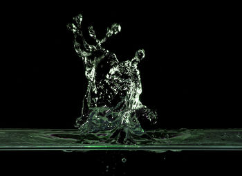 Close-up of splashing water against black background