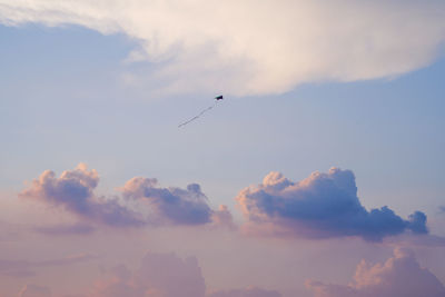 Low angle view of airplane flying in sky