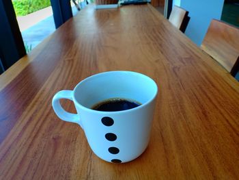 High angle view of coffee cup on table