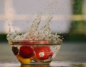 Close-up of water splashing in glass