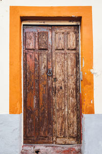 Closed wooden door of house