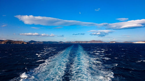 Scenic view of sea against blue sky