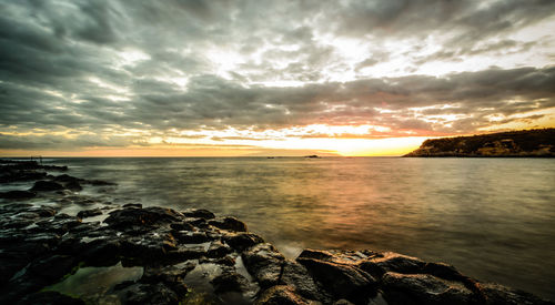 Scenic view of sea against sky during sunset