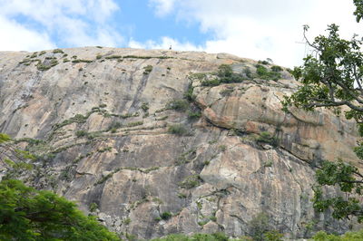 Low angle view of rock formations against sky