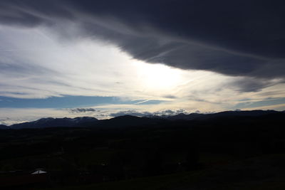 Scenic view of silhouette mountains against sky during sunset