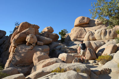 Rocks on mountain against clear sky