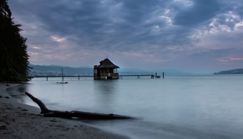 Scenic view of sea against sky at sunset