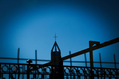 Low angle view of bridge against blue sky