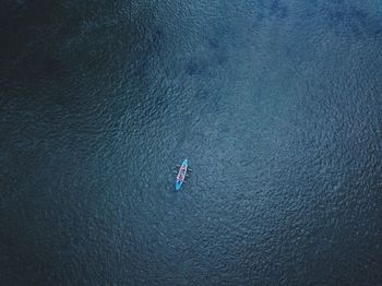 High angle view of man on boat in sea