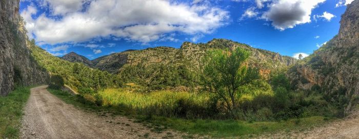 Scenic view of landscape against cloudy sky