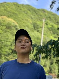 Portrait of man against plants