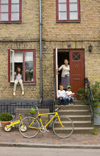 Family at entrance of house