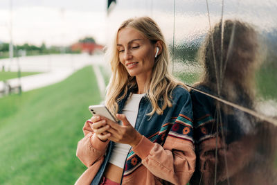 Young woman using mobile phone