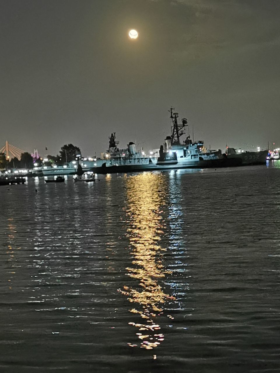 BOATS IN SEA AT NIGHT