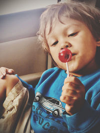 Close-up portrait of cute boy holding ice cream