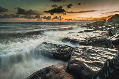 Scenic view of sea at sunset