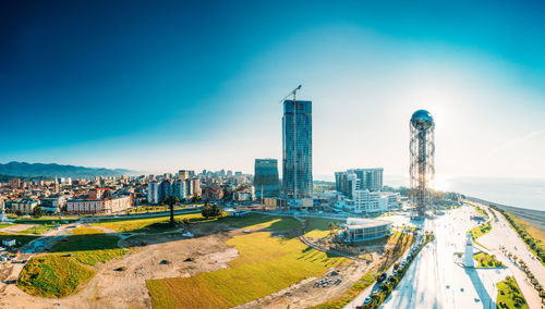 High angle view of cityscape against clear blue sky