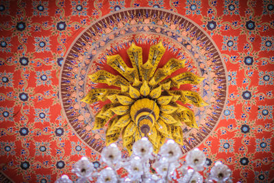 Low angle view of multi colored ceiling in temple