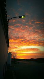 Scenic view of landscape against sky at sunset