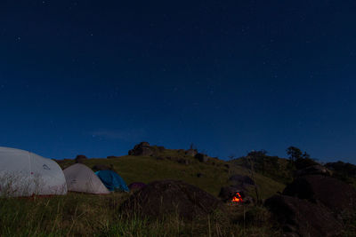 Scenic view of field against sky at night