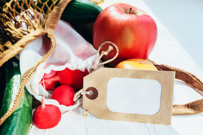 High angle view of fruits in basket on table